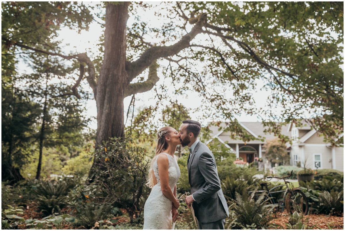 bride and groom kissing after reading vows | glenwood treefarm tacoma washington photographer