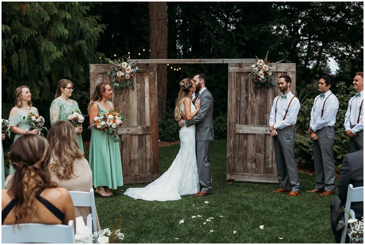 bride and groom kiss for the first time | glenwood treefarm tacoma washington photographer