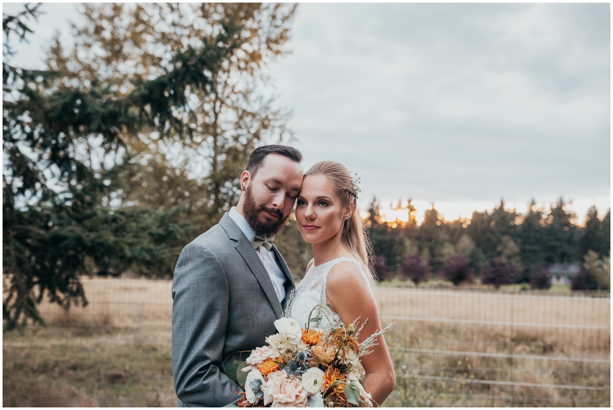 groom holds bride in portrait | glenwood treefarm tacoma washington photographer