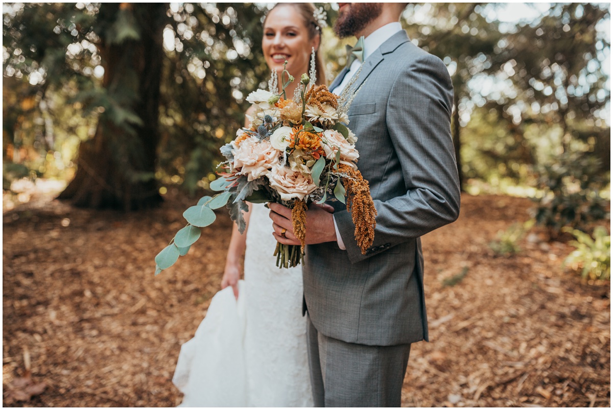 groom holds brides bouquet | glenwood treefarm tacoma washington photographer