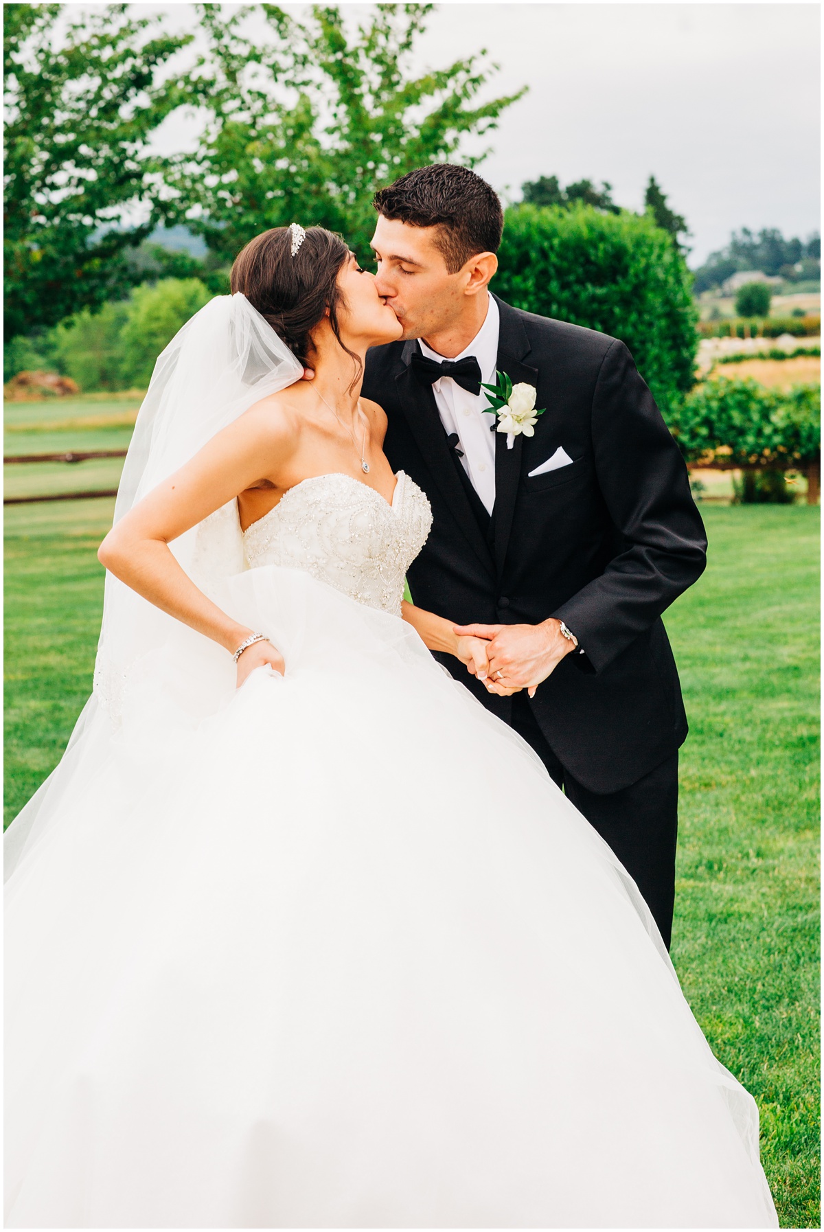 husband and bride kissing after ceremony | Hidden Meadows Wedding Snohomish Washington