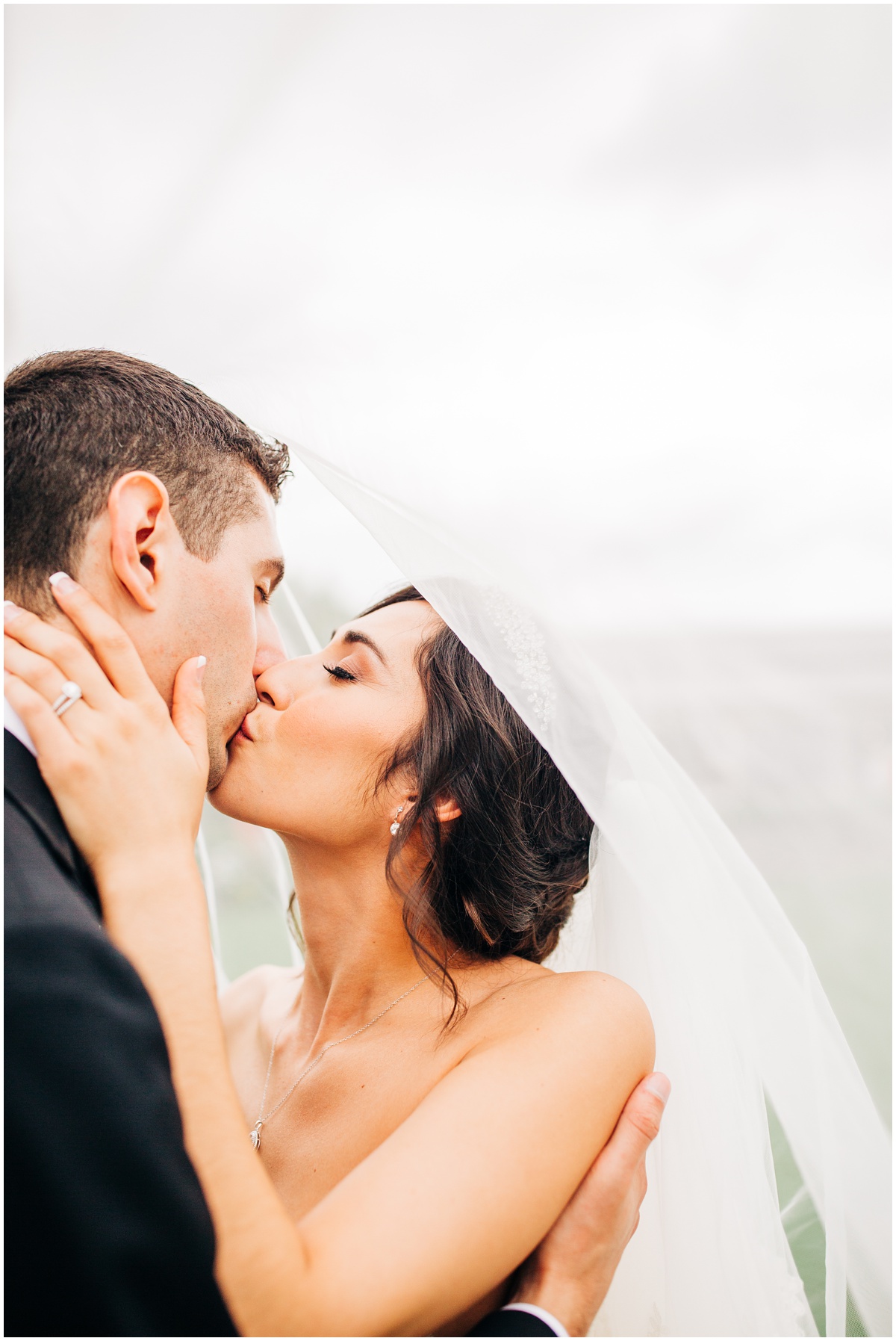 epic veil photo of kissing bride and groom | Hidden Meadows Wedding Snohomish Washington