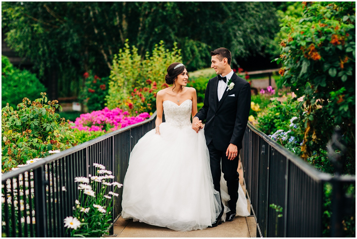 bride and groom walking on path | Hidden Meadows Wedding Snohomish Washington