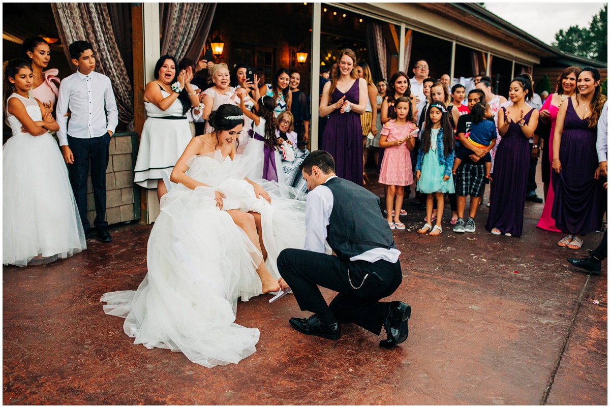 fun groom removing of the garter| Hidden Meadows Wedding Snohomish Washington
