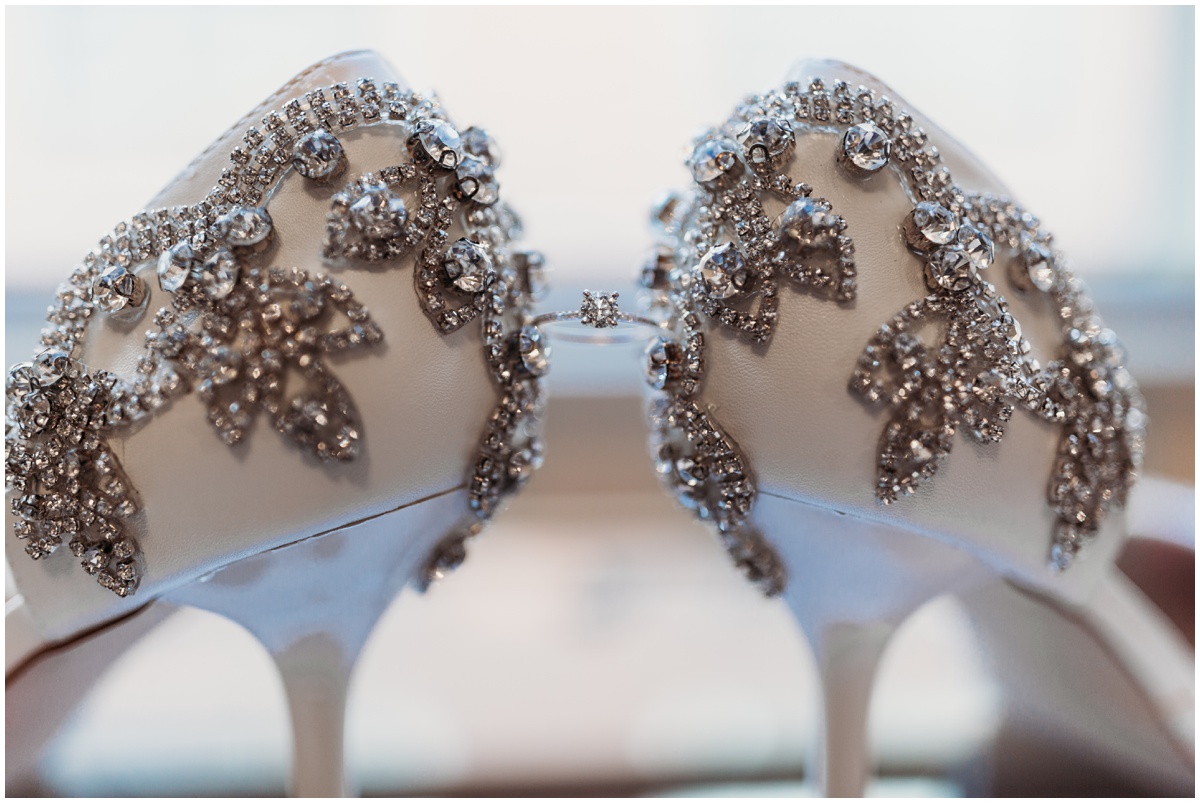 brides shoes holding ring