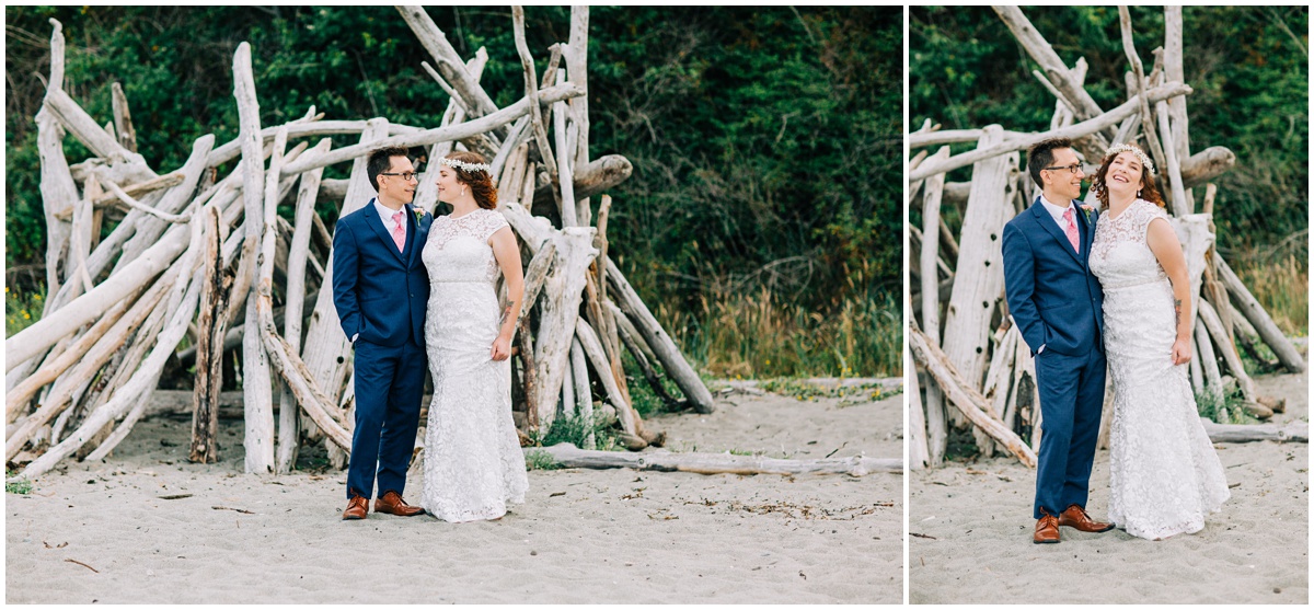 bride and groom posing by beach log stacks