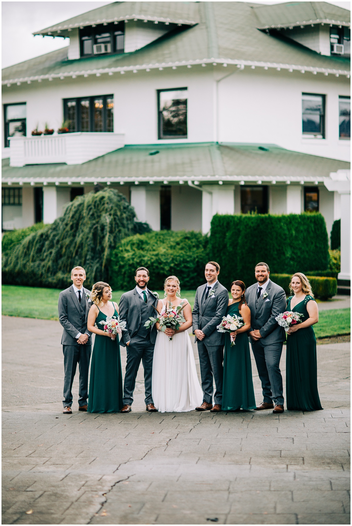 wedding party photo in front of house