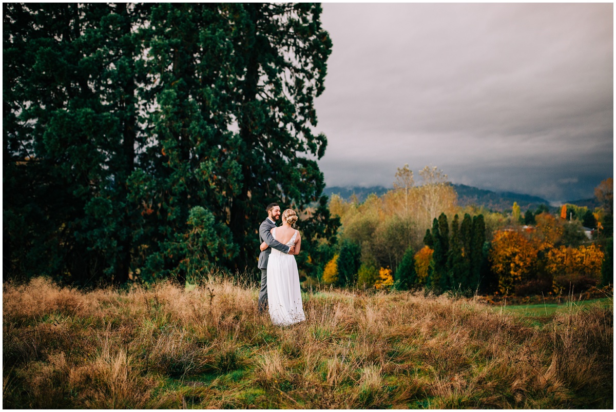 bride and groom portrait by trees