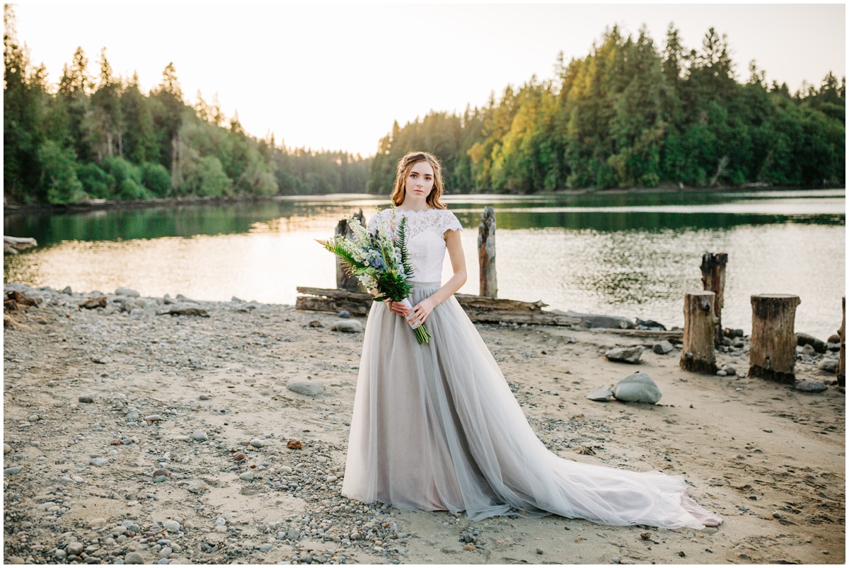 bride with grey gown holding bouquet