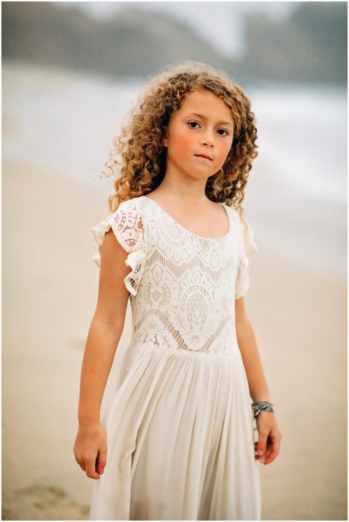 confident girl standing on beach