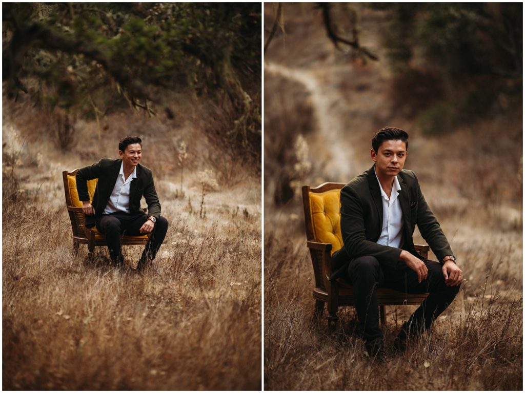 groom sitting in chair in the woods