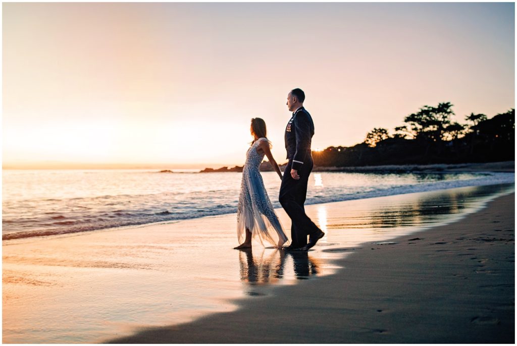 bride and groom walking to the ocean